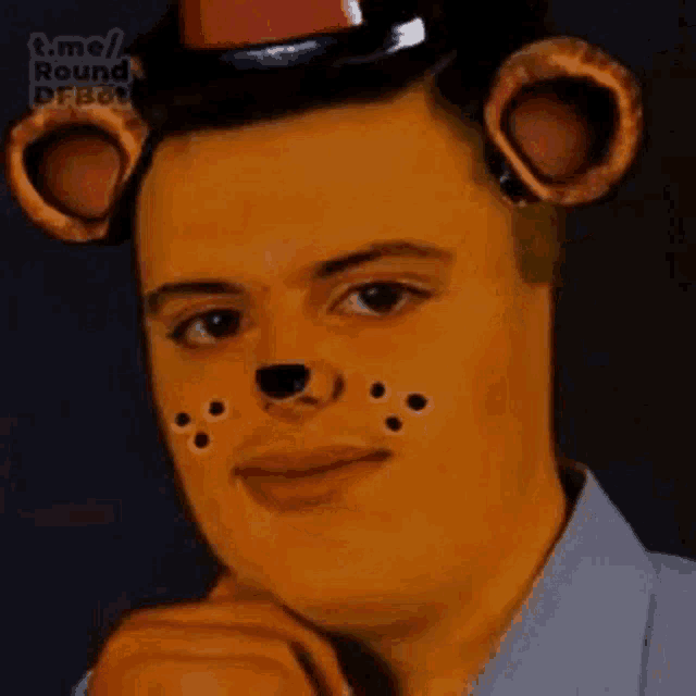 a man with a teddy bear face painted on his face is wearing a teddy bear hat .