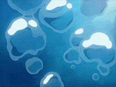 a bunch of bubbles are floating in a blue water