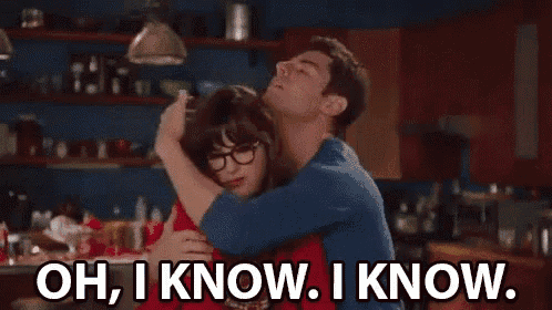 a man is hugging a woman in a kitchen and the woman is saying `` oh , i know , i know . ''