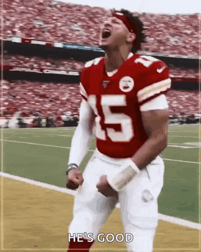 a football player with the number 5 on his jersey celebrates on the field