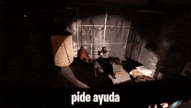 two zombies are chained to a wall in a room