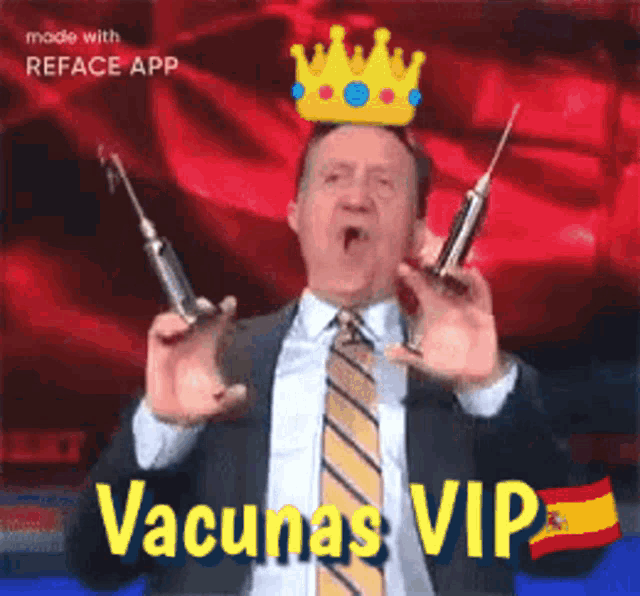 a man in a suit and tie is holding syringes and wearing a crown on his head .