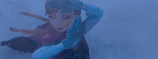 a close up of anna and elsa from the movie frozen standing in the snow .