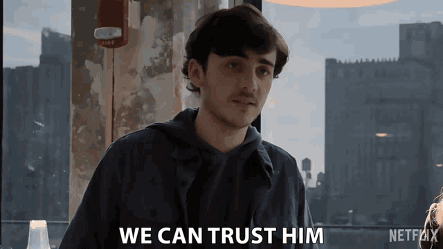 a man says " we can trust him " in front of a window