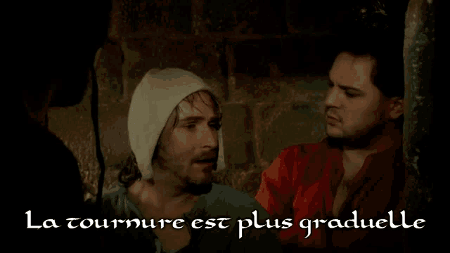 two men standing next to each other with the words la tourure est plus graduelle