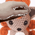 a person is petting a stuffed animal with a hat on it .