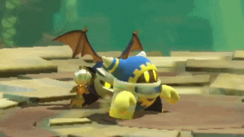 a cartoon character with wings is standing on a sandy surface .