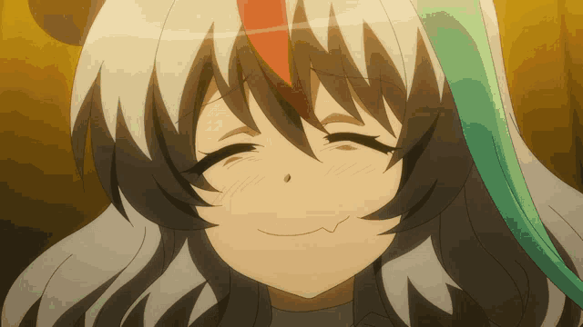 a close up of a girl 's face with her eyes closed and a smile on her face