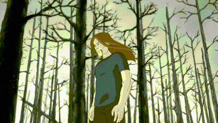 a man with long hair is standing in a forest with trees without leaves .