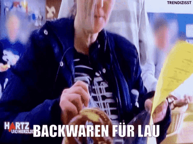 hartz backwaren fur lau is written on the bottom of a man 's shirt