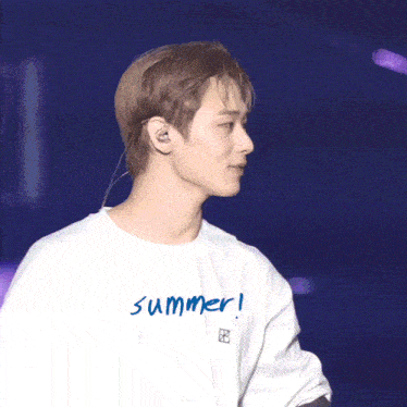 a man wearing a shirt that says summer on it