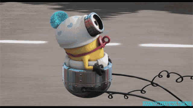a minion wearing a white hat and goggles is riding a sleigh on a road