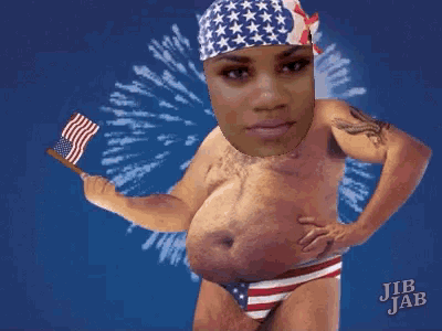 a man in an american flag headband is holding an american flag