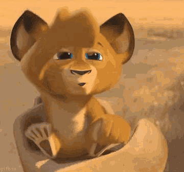 a cartoon lion cub is sitting in a basket with its paws out .