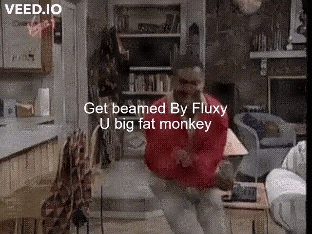 a man in a red jacket is dancing in a living room with the words get beamed by fluxy u big fat monkey below him