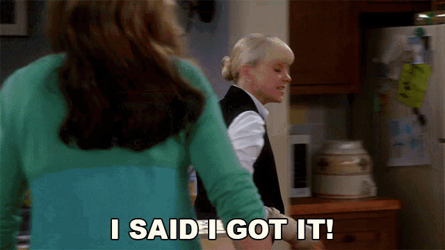 a woman says i said i got it while standing next to another woman