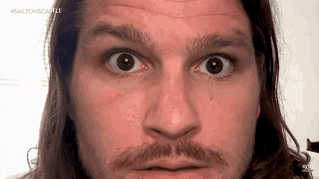 a close up of a man 's face with the hashtag #daltoncastle visible