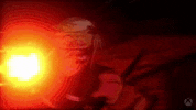 a person is holding a gun in a dark room with a red light coming out of it .