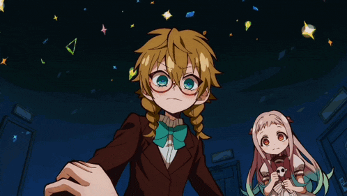 a girl with blonde hair and glasses is holding a key in her hand