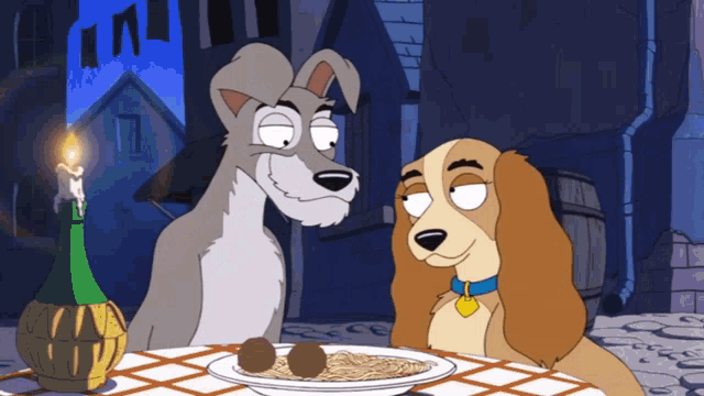 a couple of cartoon dogs sitting at a table with a plate of spaghetti
