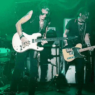 a man is playing a guitar in front of a green background that says jenny depp gifs