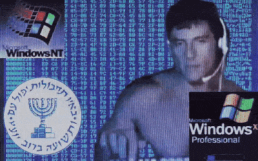 a man wearing headphones in front of a screen that says windows