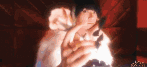a blurry picture of a person holding a sheep