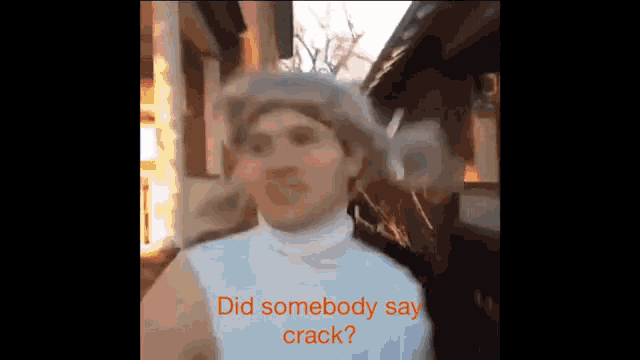a man wearing a white turtleneck and a fur hat says did somebody say crack ?