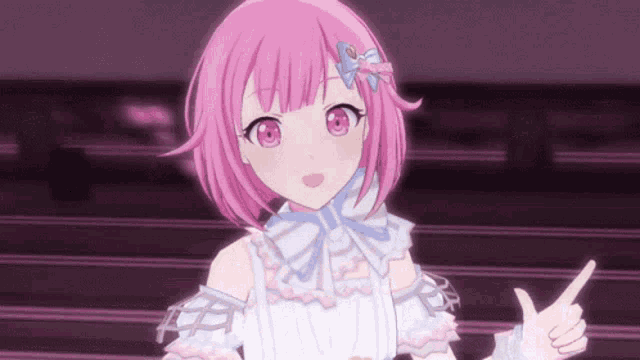 a pink haired anime girl with a bow on her hair is pointing at something .