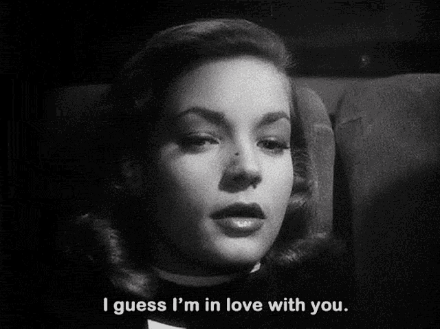 a woman says i guess i 'm in love with you in a black and white photo