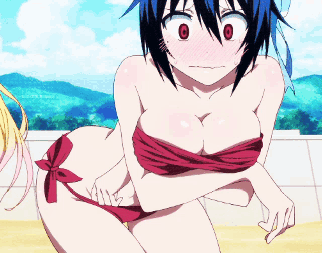 a girl in a red bikini has a red ribbon around her breast