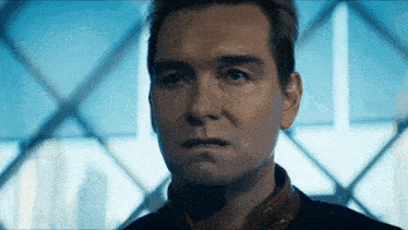 a close up of a man 's face against a window