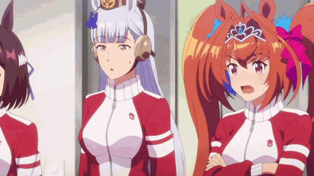 a girl with a crown on her head stands next to another girl with a crown on her head