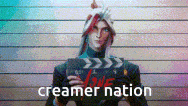 a pixelated image of a man holding a clapper board with the words creamer nation written on it .