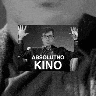 a black and white photo of a man with glasses and the words absolutno kino
