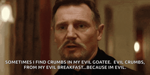 a man with a beard and mustache is talking about crumbs in his evil goatee