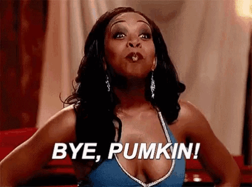 a woman is blowing a kiss and saying bye pumpkin .