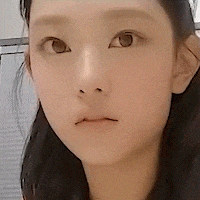 a close up of a woman 's face shows her eyes and nose
