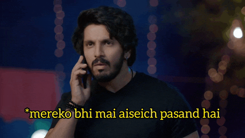 a man is talking on a cell phone with the caption mereko bhi mai aiseich pasand hai