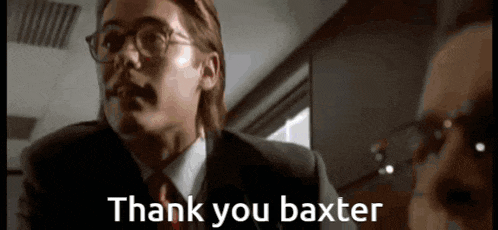 a man in a suit says thank you baxter to another man