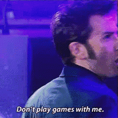 a man in a suit and tie is saying " don 't play games with me "