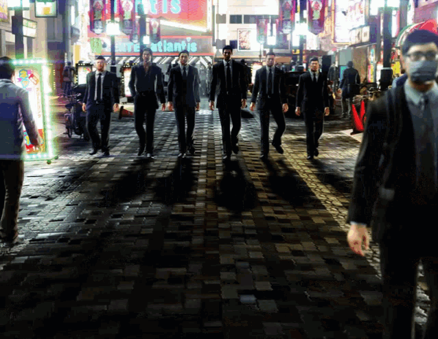 a group of men are walking down a street with a sign that says atlantis in the background