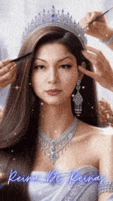 a woman wearing a tiara and necklace is getting her hair done