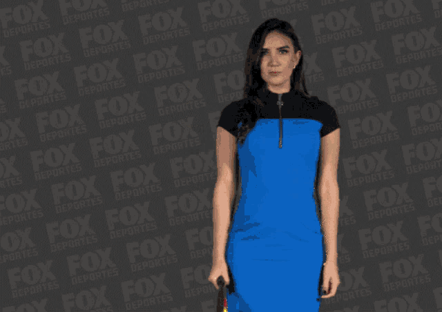 a woman holding a flag in front of a fox advertisement