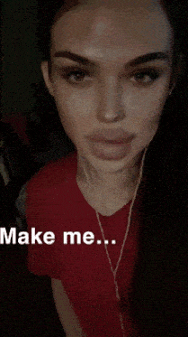 a woman wearing a red shirt and earbuds says make me