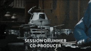 a person playing drums with the words session drummer co-producer below