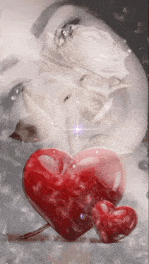 a woman 's face is behind two hearts and a white rose