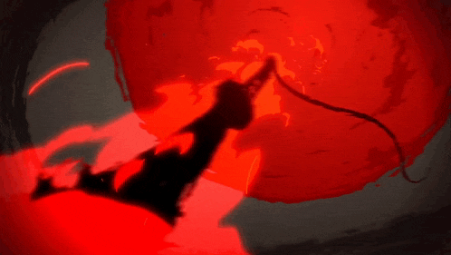 a silhouette of a person holding a sword in front of a red light