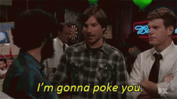 a man in a plaid shirt says " i 'm gonna poke you " to another man