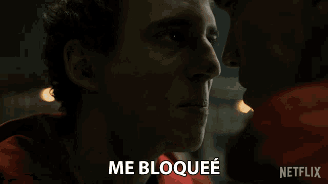 a close up of a man 's face with the words me bloquee on the bottom